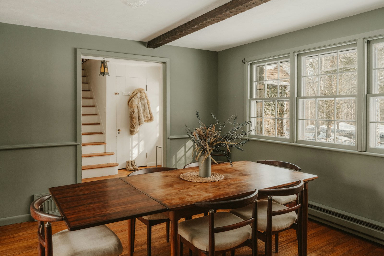 Wooden dining table in a warm dining room setting